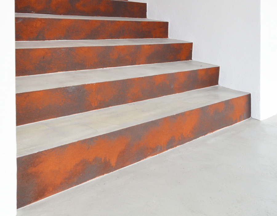 Microverlay®, low thickness concrete resin coating with taupe and Oxyrust® finish, vertical Corten effect coating. Marco stationery. Rovereto (TN). Project: Studio A22