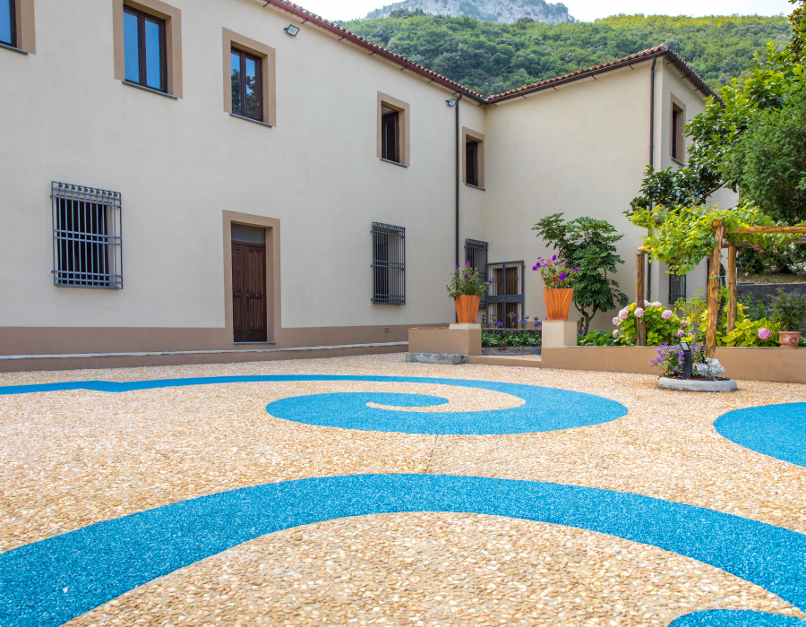 ItalianTerrazzo®, exposed aggregate paving giallo ocra and blu oltremare color. Giardino delle Arti, Maratea (Italy) Project Arch. Francesco Canestrini. 04