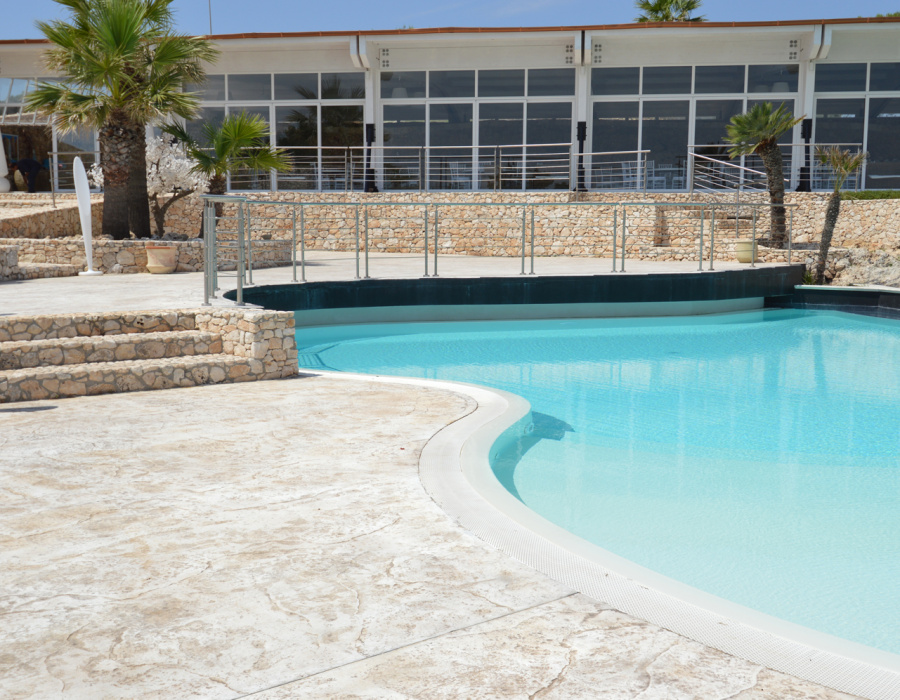 Plam Stampable, stamped concrete floor white color, tawny shades. Hotel Capo Campolato, Siracusa, Italy